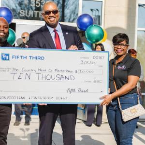 Fifth Third Chief Corporate Responsibility Officer Kala Gibson presents a $10,000 grant to The Country Meat Co. Marketplace.