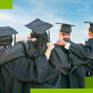 4 people in graduation robes with arms linked