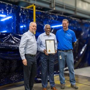 Ray Pittard, Trane Technologies Executive Vice President and Chief Officer, Integrated Supply Chain; Fort Smith Mayor George McGill and Carter Roth, Trane Fort Smith Plant Manager hold a proclamation declaring today (February 21) Trane Fort Smith Day