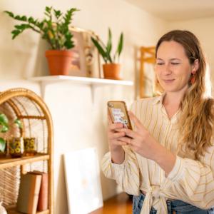 Sarah Small looking at a phone