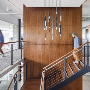 GoDaddy offices, Kirkland. Employee walking down a set of stairs.