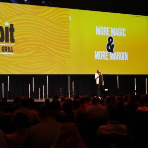 Presenter on stage at GFC