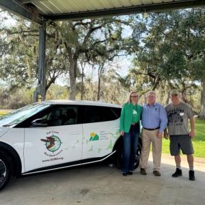 (L to R): Rebecca Emrick, Martin Hagne, and Mike Williams representing Green Mountain Energy Sun Club and Gulf Coast Bird Observatory at the "Flip the Switch" event on January 8.