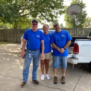 3 GP volunteers smile together for a picture