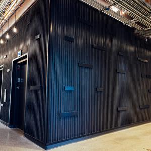 Gen2® elevator bank within a timber hoistway