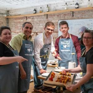 HARMAN volunteers shown preparing meals for the homeless.