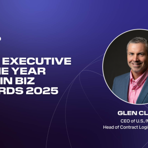 Graphic announcing Glen Clark as Gold Executive of the Year in the 2025 Best in Biz Awards. The left side features the DP World logo and bold white text on a purple–blue gradient background. On the right is a circular headshot of Glen Clark, wearing a blue blazer and pink checkered shirt, smiling against a dark backdrop.
