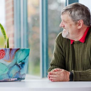 GoDaddy employees seated at a conference table.