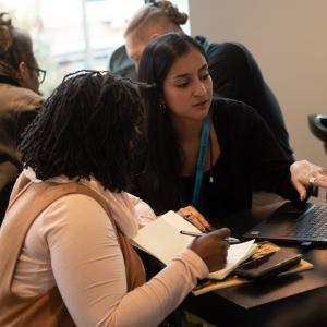 Two women shown at the workshop during GoDaddy Open
