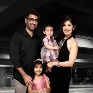 Richa Gandhi with her husband and two daughters.