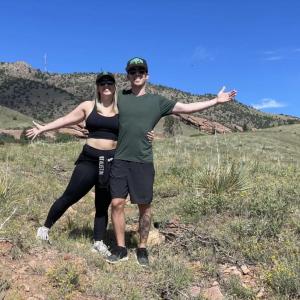Erik and his wife shown on a hike.