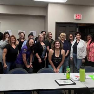 GoDaddy team photo in a conference room.