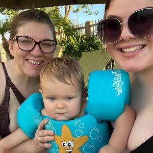 Sarah Smith at the pool with a young child.