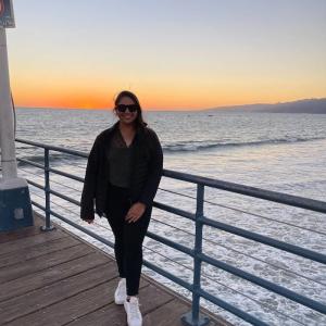 Shaiza shown at a waterfront.