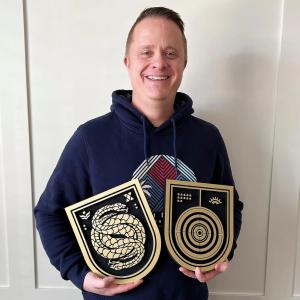 Lee Glasgow holding two of his creations.