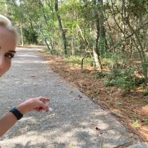 Mel Saettone hiking on a path.