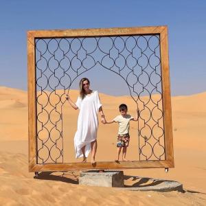 Selina in the desert with her son.