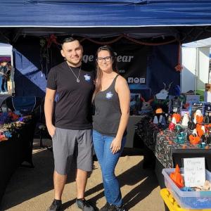 Victor and his wife at their small business.