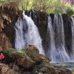 Christie in front of a waterfall.