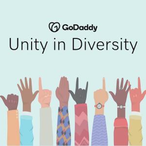 GoDaddy: Unity in Diversity. Hands of different colors raised.