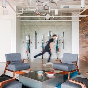 A person on a skateboard in the GoDaddy offices.
