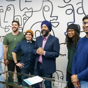 GoDaddy CEO Aman Bhutani celebrates signing the CEO Action for Diversity & Inclusion pledge with GoDaddy employee resource group members.