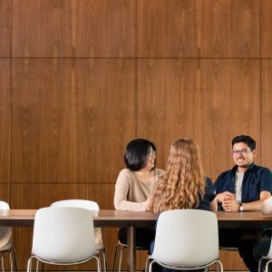 Four people sitting at a table.