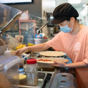 Mia Oi making a crepe.