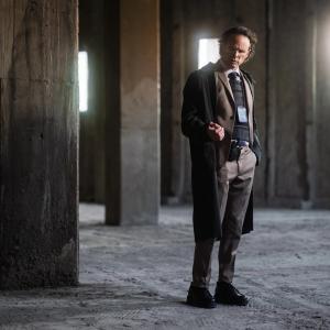 Walter Goggins in a warehouse.