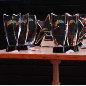 Golden Bridge Award trophies on a small table