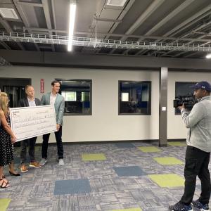 KeyBank and Goodwill team members holding the grant check.