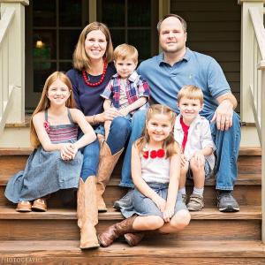 The Gossling family shown on the front porch of their home.