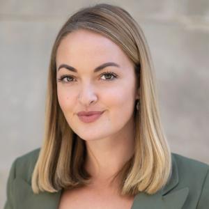 Profile picture of woman in light green blazer, Grace Coleman