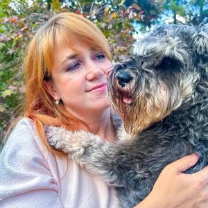 Mariia Sviatyi and Grey, the dog.