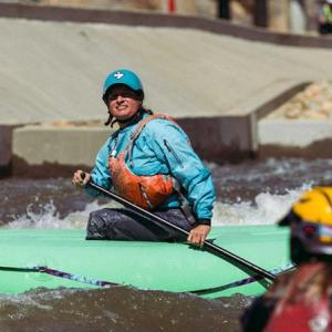 person kayaking in the river 