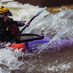Person kayaking in the river