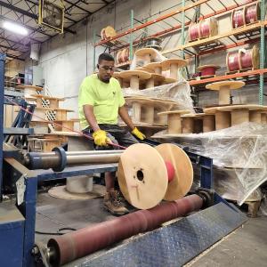 Wesco employee cutting wire in Kansas City, Kansas.
