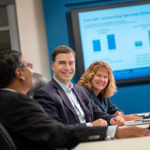 Wesco CEO John Engel (center) with other executives at Pittsburgh headquarters.