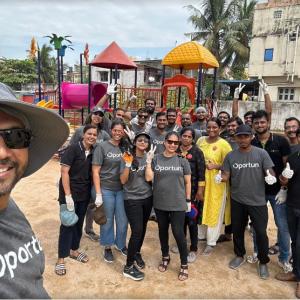 people smiling and standing together outside