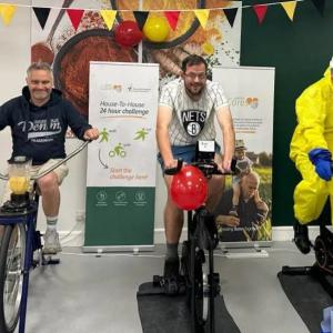 Three people riding bikes to raise donations