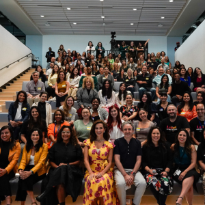 A large group of people sat on a staircase 