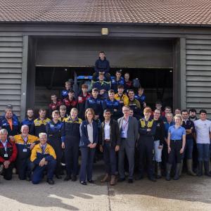 large group photo of UK Prime Minister, Rishi Sunak, with New Holland engineering apprentices 