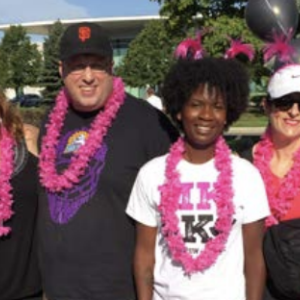 A group of people stood together for a photo 