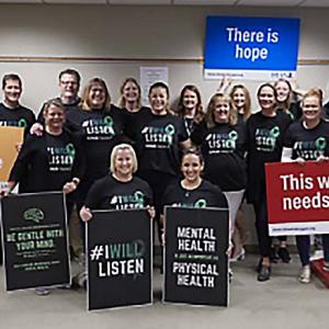 people holding signs