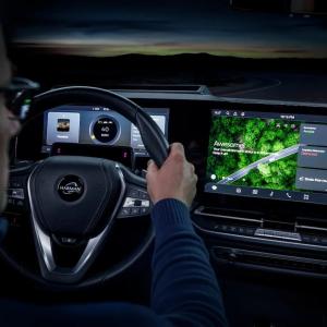 Driver shown viewing a HARMAN TechCrunchheads up display.