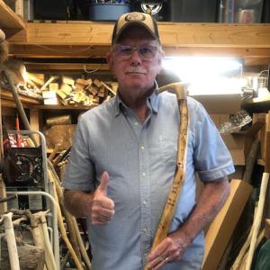 Guy of Guy's Canes for Veterans posing with a cane.