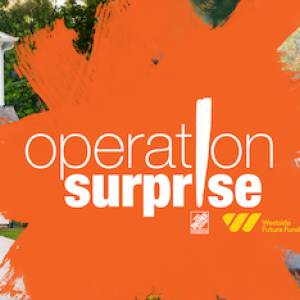 Operation Surprise logo. Family is standing in front of their newly renovated home. A woman is hugging a young girl. 