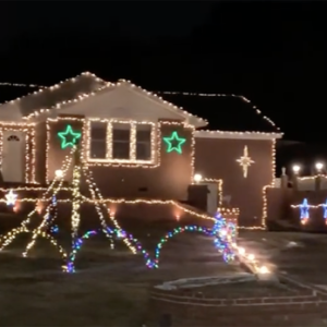 A gingerbread house lit at night in Jonesboro, GA.