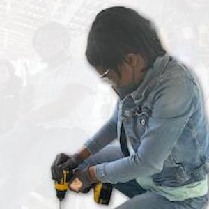 Girl Scouts of the USA shown performing simple repairs. 