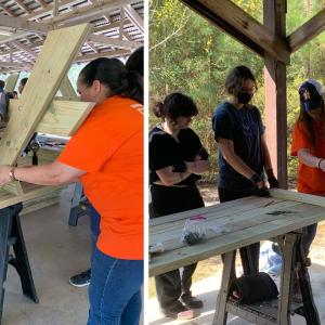 Home Depot volunteers work with Girl Scouts to build a picnic table.